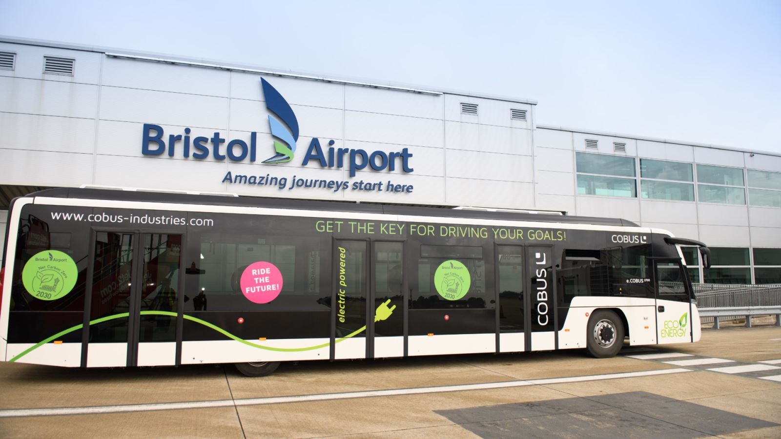 Electric Co-Bus infront of the Bristol Airport sign